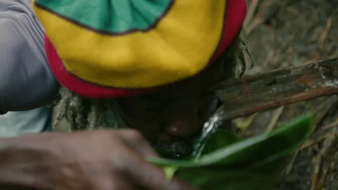 Rasta Man Drinking Fresh water Stock Footage 271528681