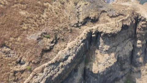 Ratangad basalt cliff face aerial in the Sahyadri Western Ghats India Stock Footage 341126693