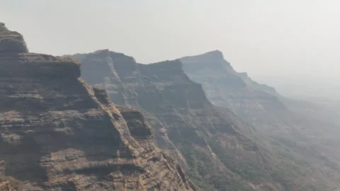 Ratangad layered cliffs and escarpment aerial Maharashtra India 動画素材 341128064