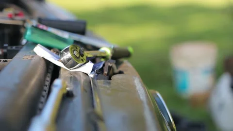 Ratchet and tools laying on front of car cinematic HD Stock Footage 143070098