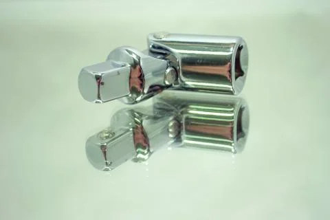 Ratchet socket wrench angle coupling closeup on mirror Stock Photos