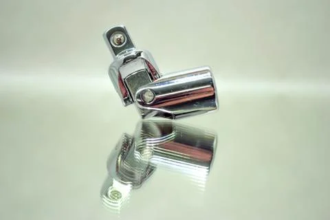 Ratchet socket wrench angle coupling closeup on mirror Stock Photos