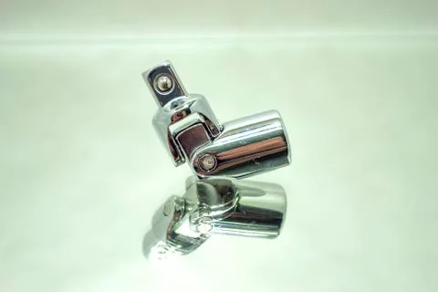Ratchet socket wrench angle coupling closeup on mirror Stock Photos