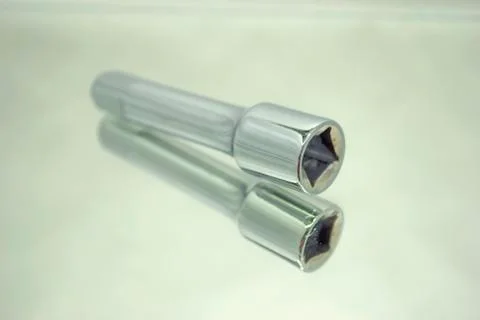 Ratchet socket wrench coupling extension on mirror Stock Photos