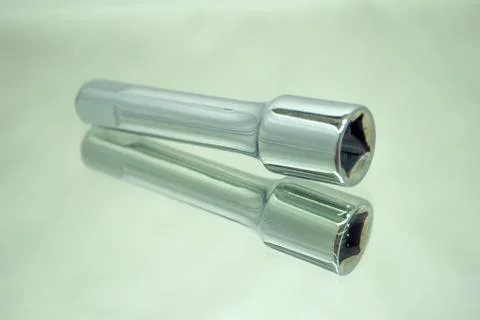 Ratchet socket wrench coupling extension on mirror Stock Photos