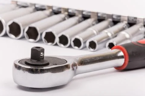 Ratchet with sockets blurred background Stock Photos