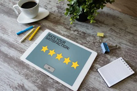 Rate your experience. Customer satisfaction review. Five star on device screen Stock Photos