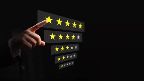 Rating scale shows a hand selecting a yellow star representing a rating Stock Photos