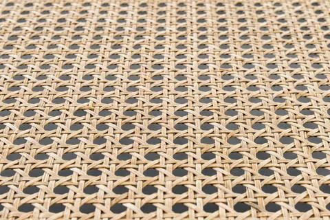 Rattan texture with fine weaving patterns in natural fibers as background Stock Photos