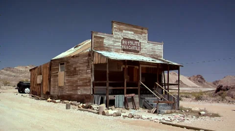 Rattle Snake Sign at the Ghost Town of the deserted Goldmine Town of Rhyolite Stock Footage
