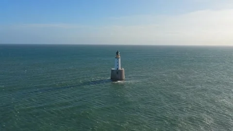 Rattray head lighthouse standing in the vast north sea Stock Footage 334057851