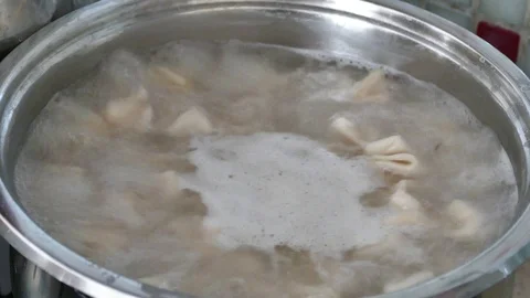 Ravioli cooked in pots, ravioli is boiling in water, Stock Footage 117923005