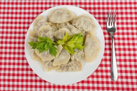 Ravioli in a white plate on the table Stock Photos