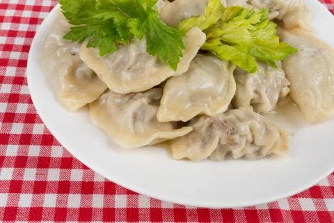 Ravioli in a white plate on the table Stock Photos