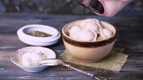 Raviollo dumplings sprinkled with salt Stock Footage 65432162