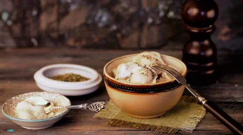 Raviollo dumplings sprinkled with salt Stock Footage 65448296