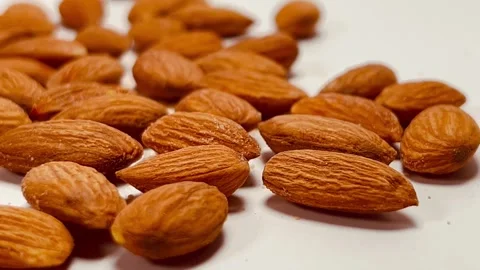 Raw almond nuts on white background close up Stock Footage 336471317