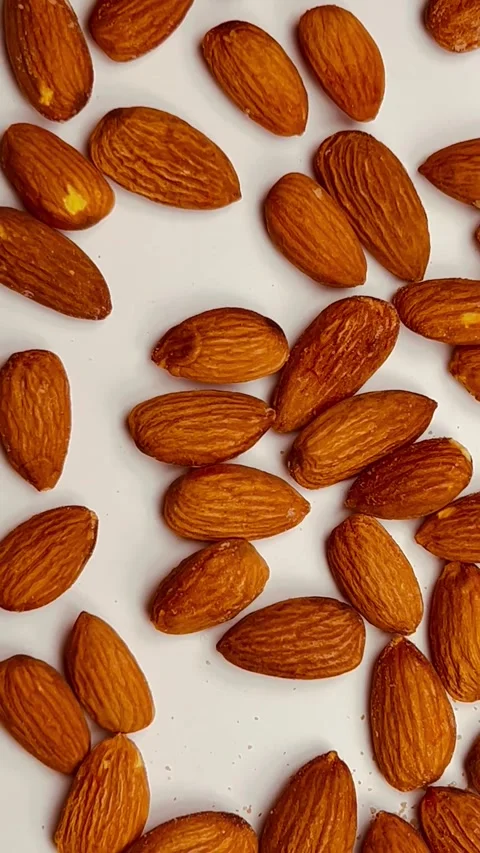 Raw almond nuts on white background top view Stock Footage 336471325