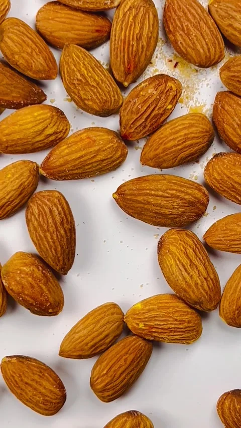 Raw almond nuts on white background top view Stock Footage 336471326