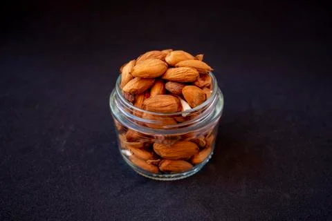 Raw almonds inside a pot, Stock-Fotos