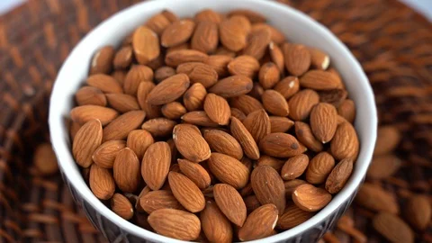Raw Almonds Nuts In A Plate, Healthy Paleo Food, Magnesium Superfood Stock Footage 120525682