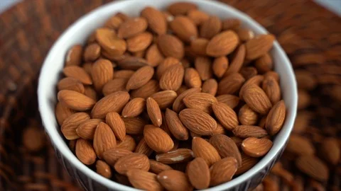 Raw Almonds Nuts In A Plate, Healthy Paleo Food, Rotating On A Table Stock Footage 120525686