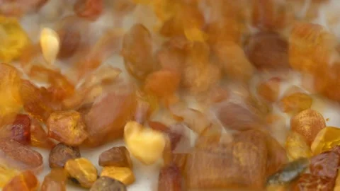 Raw Amber Stones Falling Down Slow Motion Close-up Stock Footage 150996530