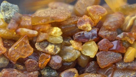 Raw Amber Stones Falling Down Slow Motion Close-up Stock Footage 150996551