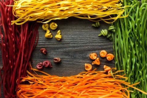 Raw and multicolored pasta Stock Photos