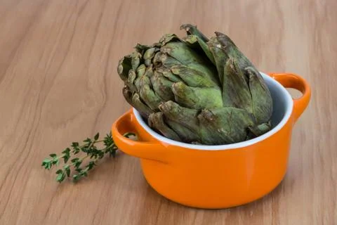 Raw artichokes Stock Photos