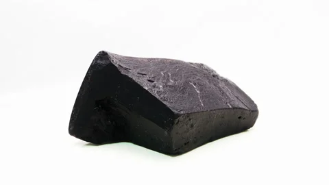 Raw Australia Black Nephrite Jade rough with a polished face in 4K Stock Footage 218321654