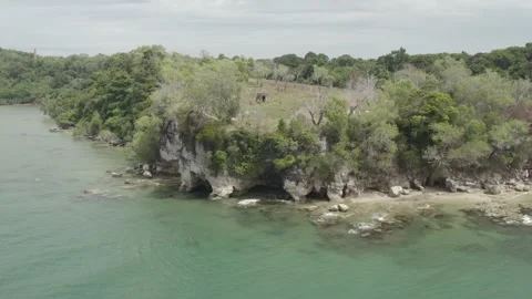 Raw backward drone shot sea showing coast Stock Footage 247401539