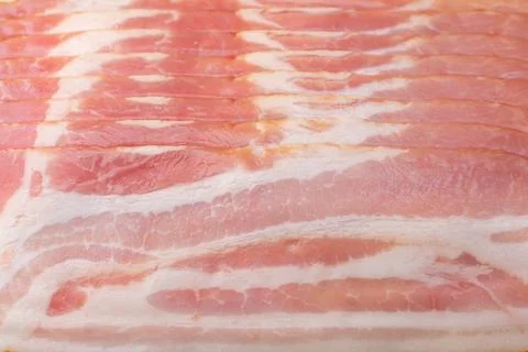 Raw bacon cut into thin slices Stock Photos