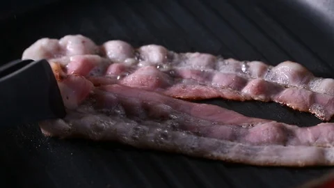 Raw Bacon Frying On Grill Pan Stock Footage 90965670