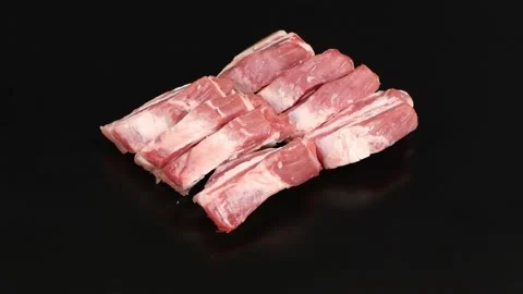 Raw bacon, isolated on black. Side view. Loop motion. Stock Footage 170374929