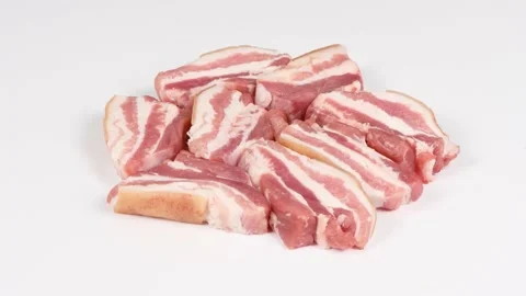 Raw bacon, isolated on white. Side view. Loop motion. Stock Footage 170376503