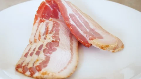 Raw Bacon on a Plate Stock Footage 130157203