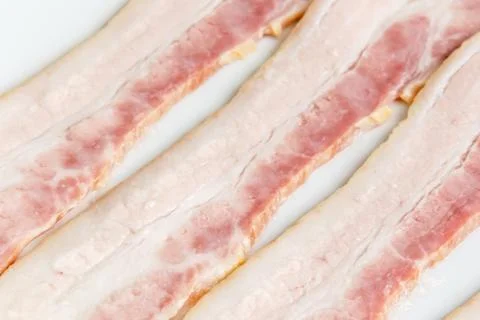 Raw bacon strips slices Foto stock