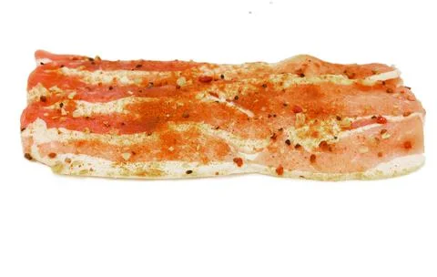 Raw bacon on a white background. Fresh pork meat with herbs and spices Stock Photos