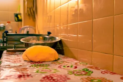 Raw balls of bread in the kitchen table Stock Photos