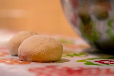 Raw balls of bread in the kitchen table Stock Photos