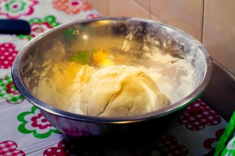 Raw balls of bread in the kitchen table Stock Photos