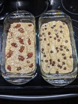Raw Banana Bread Batter in Two Dishes with Toppings Ready to be Baked Stock Photos