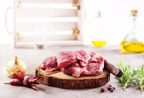 Raw beaf on a light table. Stock Photos