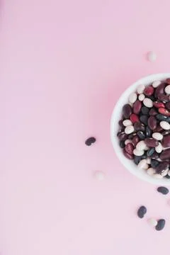 Raw beans in a cup on the background Stock Photos