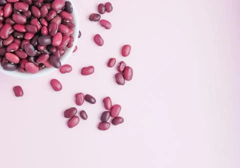 Raw beans in a cup on the background Stock Photos