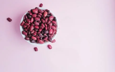 Raw beans in a cup on the background Stock Photos