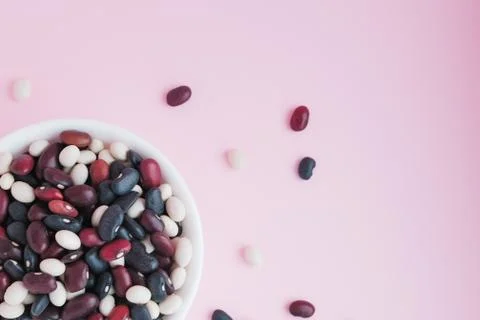 Raw beans in a cup on the background Stock Photos