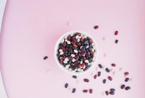 Raw beans in a cup on the background Stock Photos
