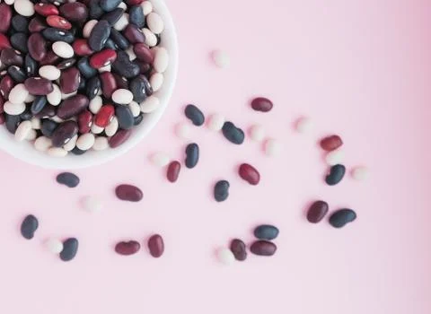 Raw beans in a cup on the background Stock Photos